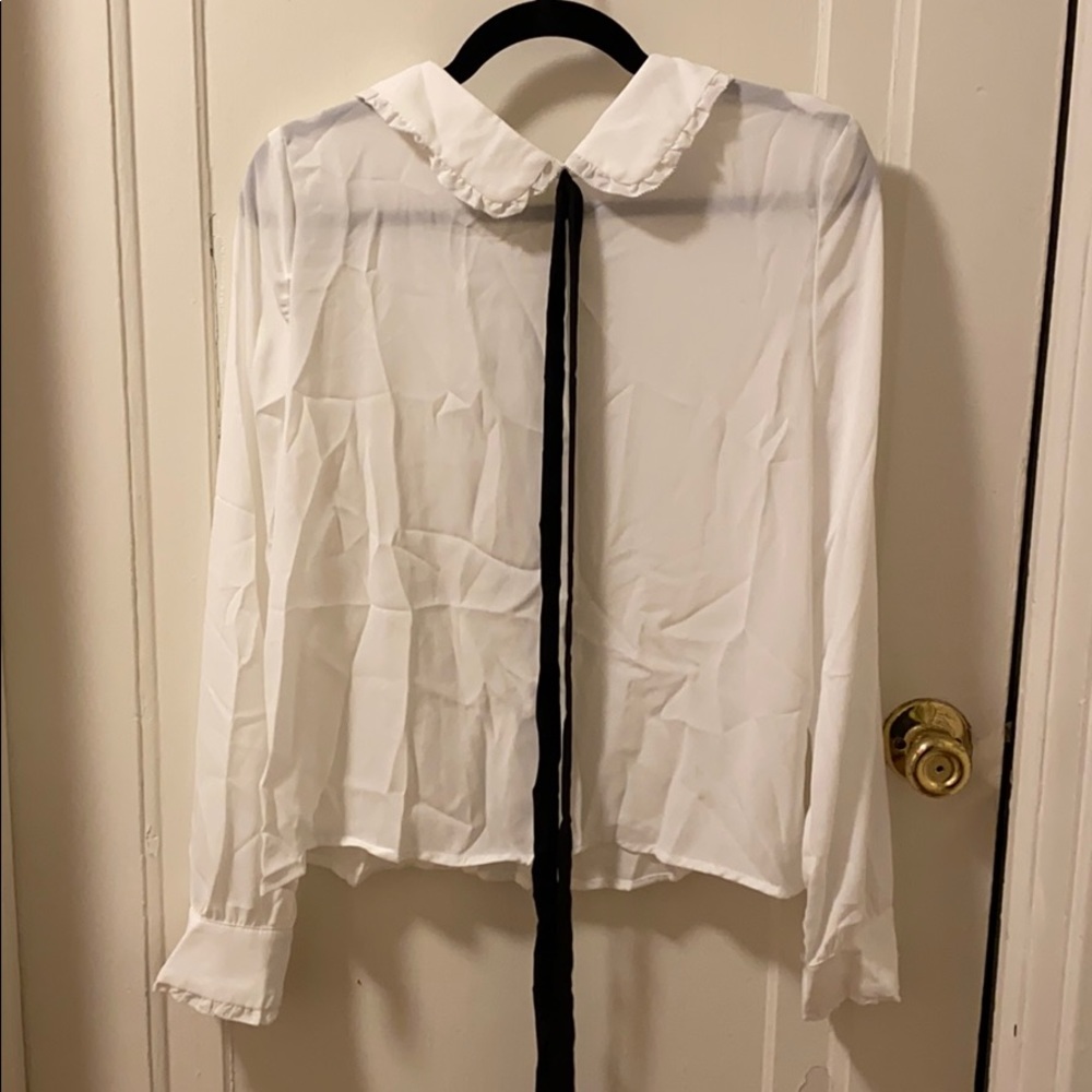 Color white blouse with a tie up bow